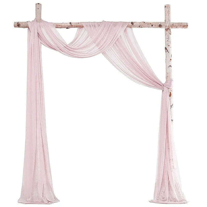 Pink chiffon drapes forming an elegant arch for weddings and events