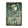 Vintage metal wall decor featuring a quote 'Sometimes I Just Look Up' with a moon and dragonflies.