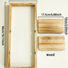 A wooden floating shelf with a rectangular frame and two attached wooden planks for plants or decor.