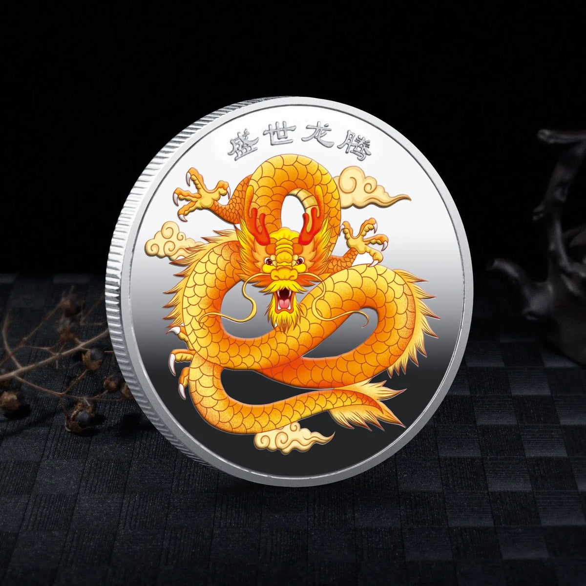 A round collectible coin featuring a golden dragon design against a silver background.