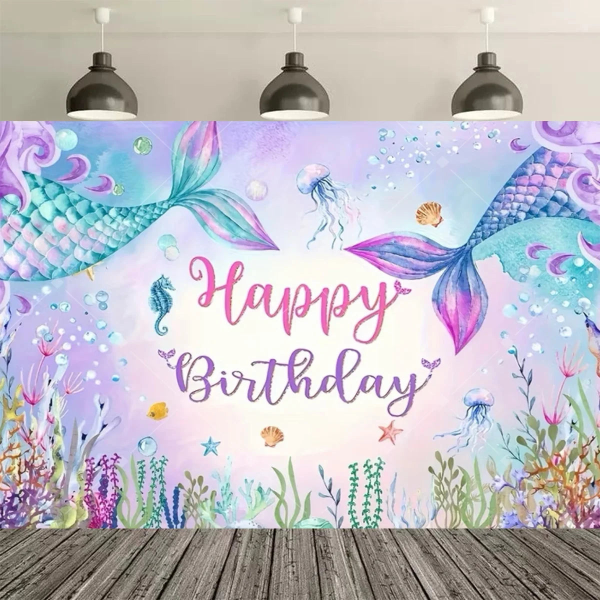 A vibrant watercolor backdrop featuring a mermaid tail, sparkling water, and floral elements for a birthday celebration.