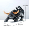 A black and gold modern animal sculpture resembling a bull or ox, shown from the side.
