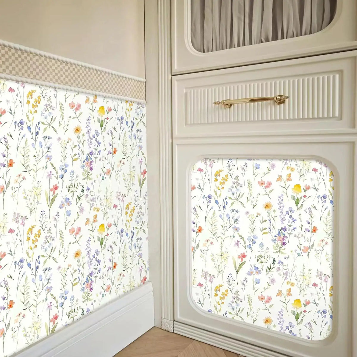 Boho floral peel and stick wallpaper featuring a dense pattern of multicolored wildflowers on a white background.