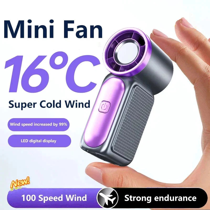 A hand holds a purple and silver mini fan with a digital display, demonstrating its strong wind capability.