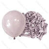 A bunch of mauve latex balloons in neutral shades laid out for baby shower or birthday décor.