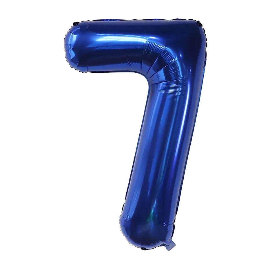 A large, dark blue foil number balloon shaped like the numeral 7.