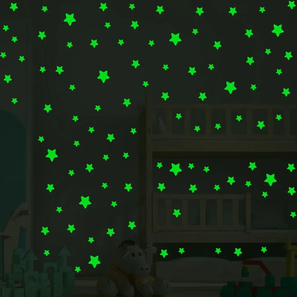 A wall decorated with green glow-in-the-dark star decals in a bedroom setting.