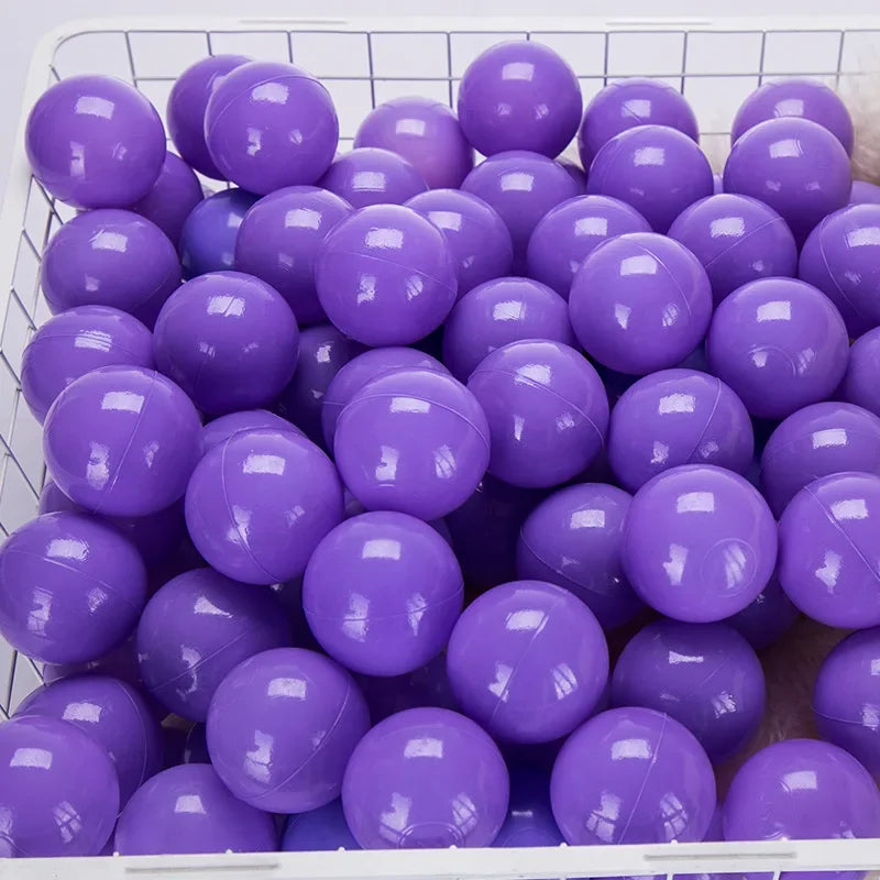 A collection of purple and blue shiny plastic balls for kids' play areas