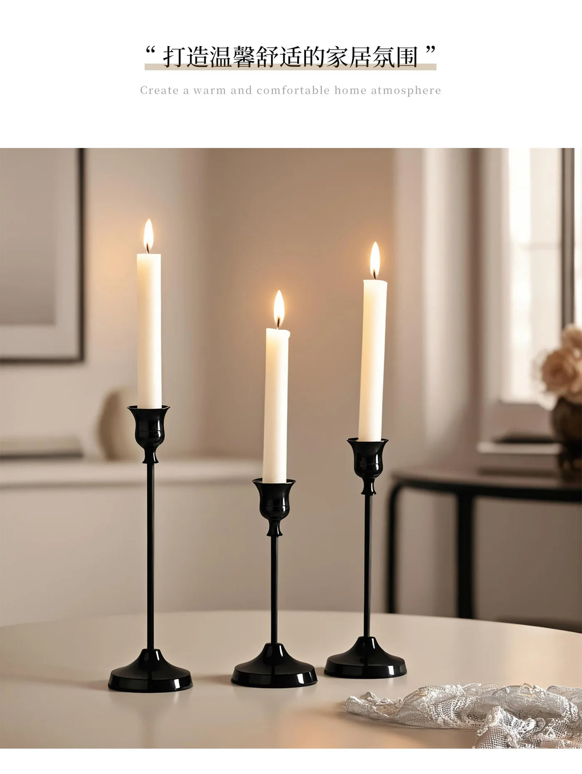 Three elegant black metal candlesticks with white candles on a table for home decor