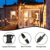 A set of solar powered outdoor string lights illuminating a modern house facade at dusk.