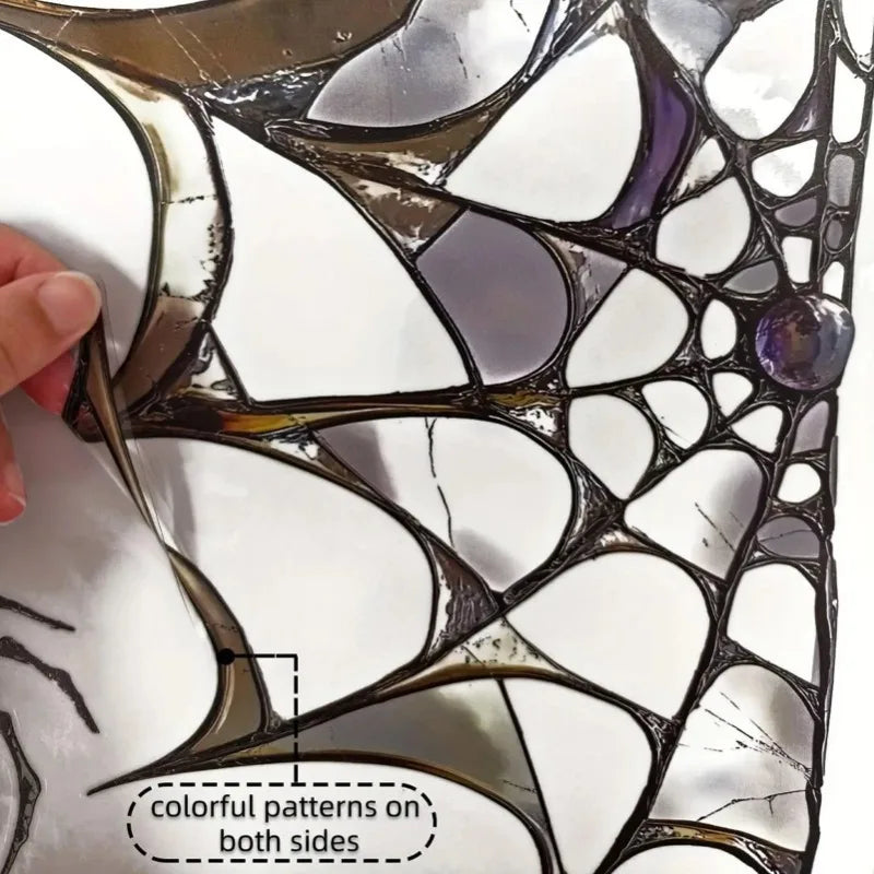 Close-up of Halloween spider web window decals showing colorful patterns on both sides