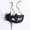 Black lace masquerade mask adorned with black feathers and rhinestones