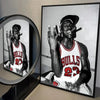 A framed photo of a basketball player wearing a Bulls jersey with the number 23 and a cap.