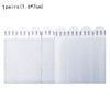 One pair of reusable double-sided adhesive picture hanging strips with small white arrows on the top.