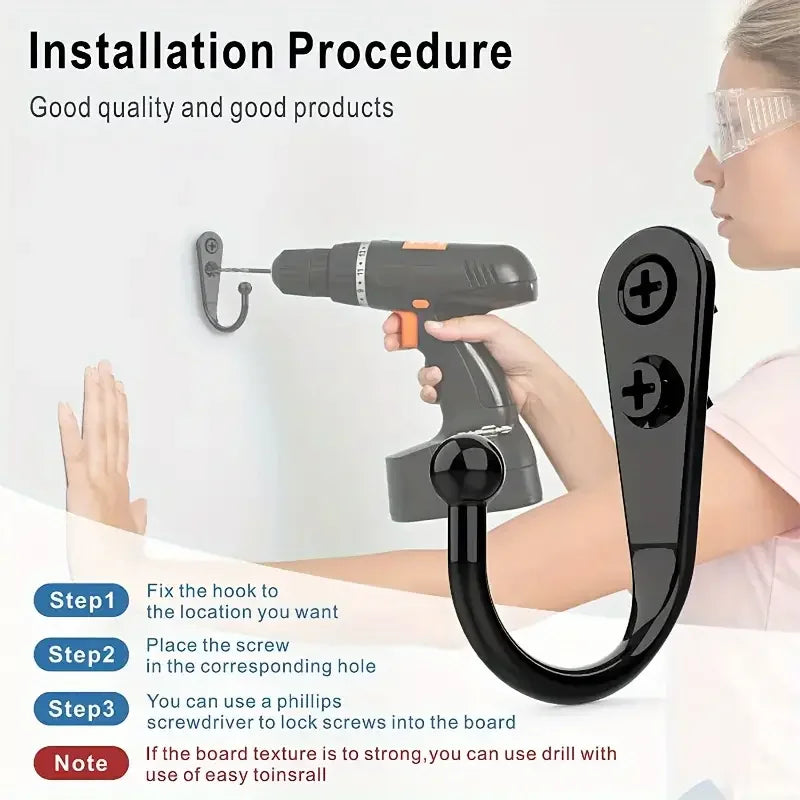 A hand is installing an aluminum wall-mounted hook using a power tool and screwdriver into a wooden board.