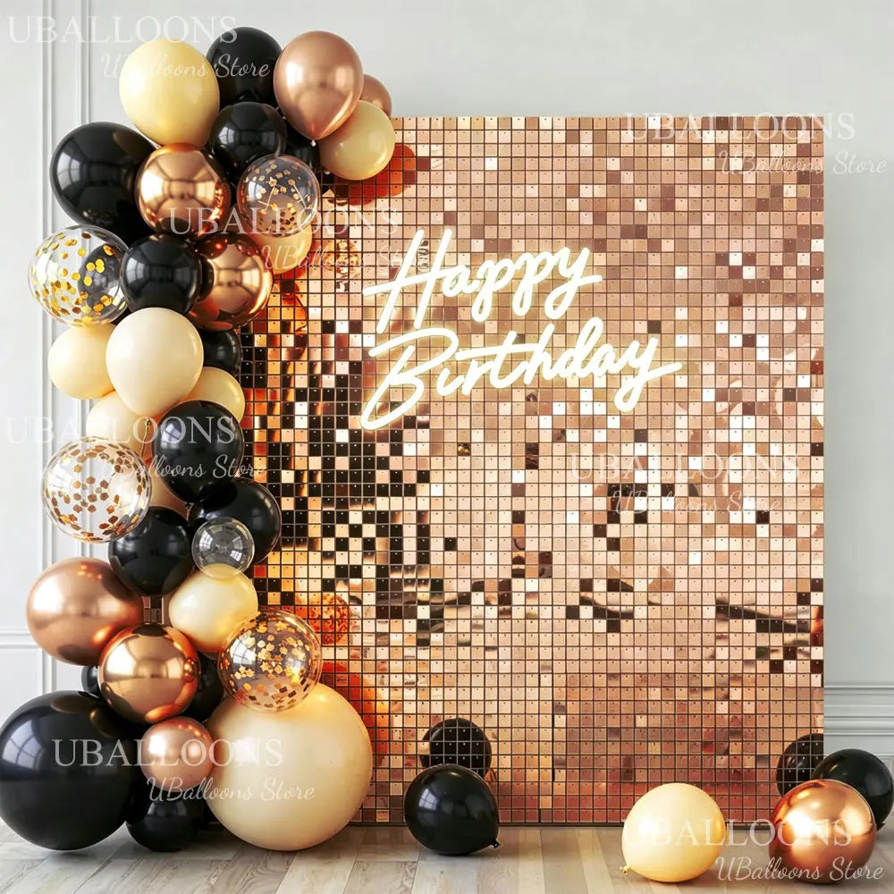 A square wall backdrop covered in gold and bronze sequins with the text Happy Birthday in sparkling gold script.