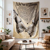 A large fabric wall tapestry featuring the text We're a Team and an illustration of two hands clasped together.