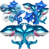 A collection of blue shark foil balloons in various sizes and shapes for an ocean-themed party decoration