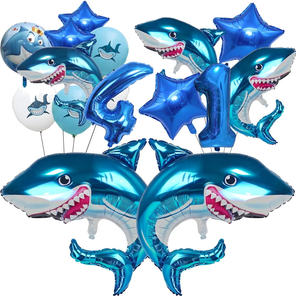A collection of blue shark foil balloons in various sizes and shapes for an ocean-themed party decoration