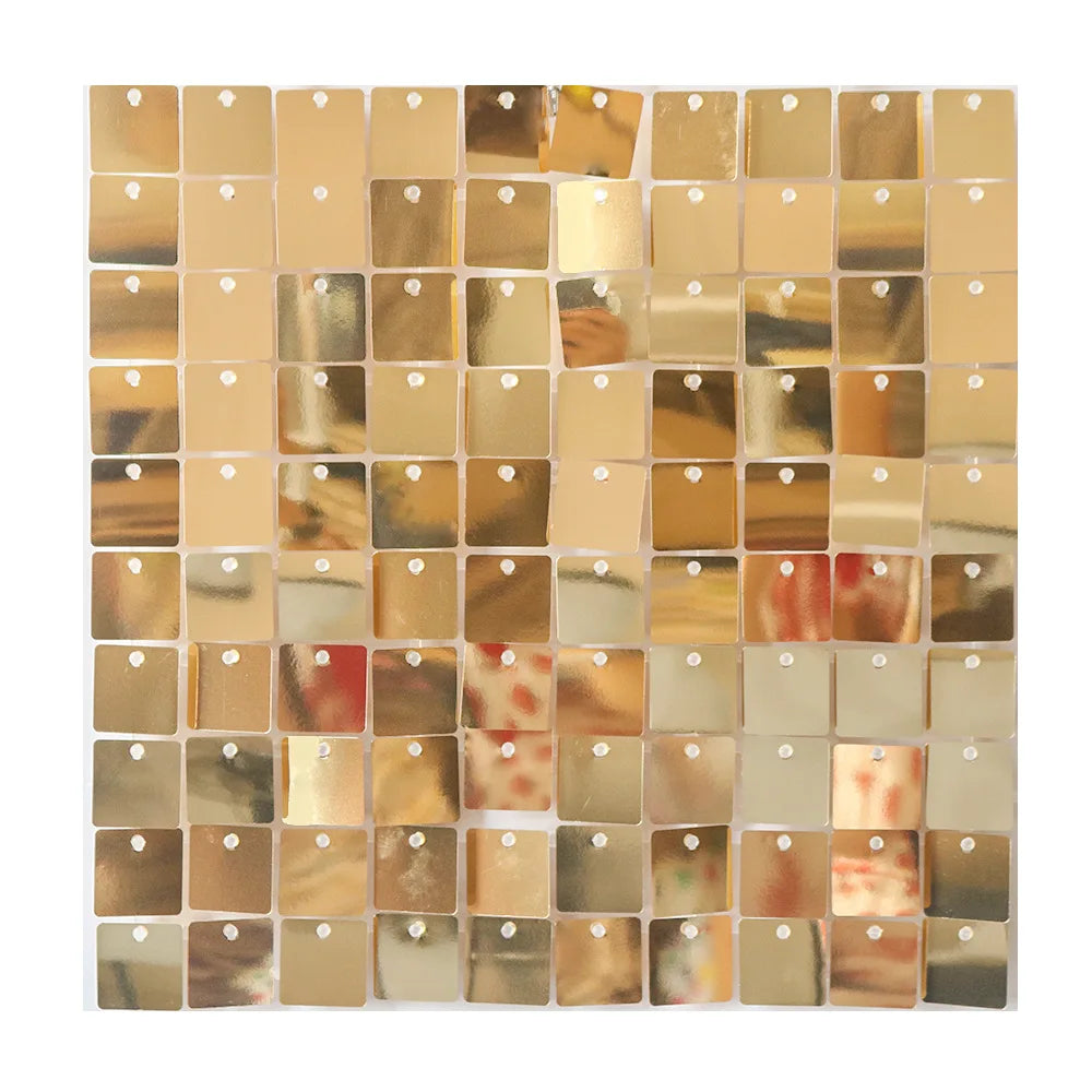 A grid of square gold and rose gold glitter panels used as a wall backdrop.