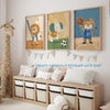 A set of three canvas prints featuring cute animal characters like a lion, elephant, and tiger for kids' room decor