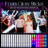 A display of LED foam glow sticks in various colors and light modes, shown being held by people.