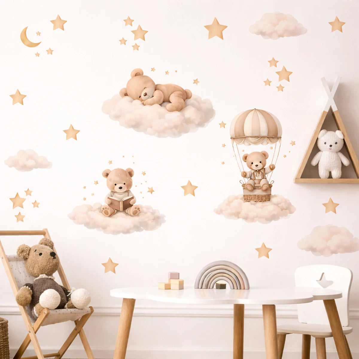 Wall stickers featuring cartoon bears, clouds, and stars decorating a white wall.