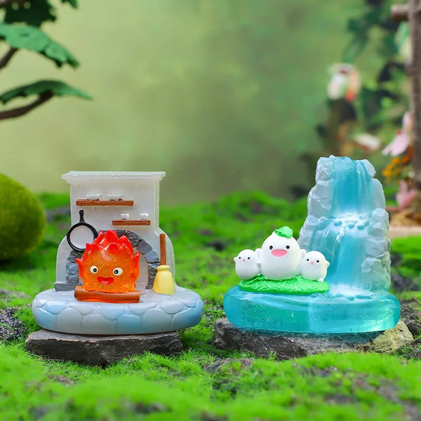 A blind box featuring a ceramic lamp ornament with an orange face and a blue ice sculpture of white birds.
