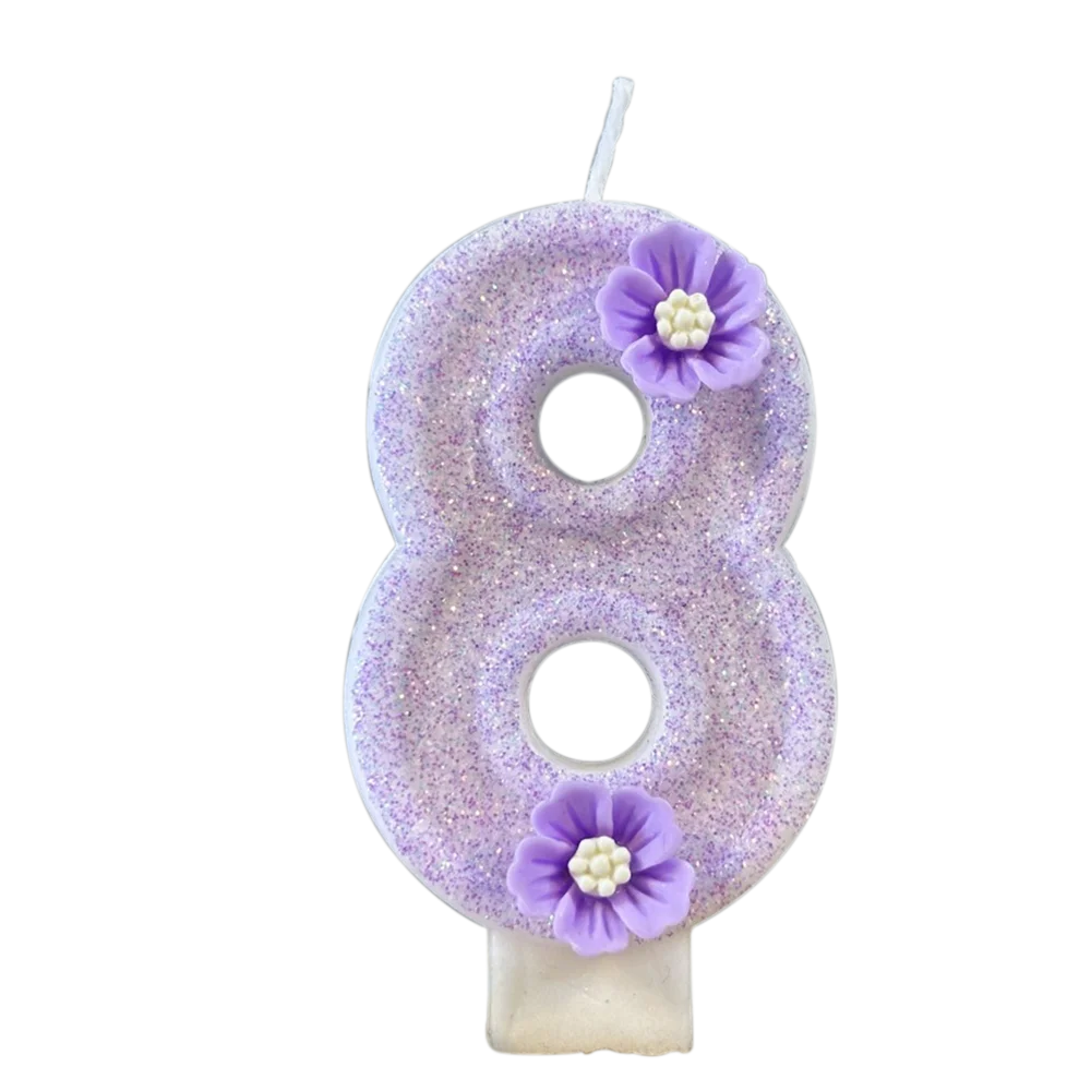 A purple sparkling number eight candle decorated with small purple flowers.