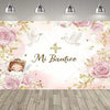 A floral pink backdrop for a First Communion featuring a cross and angelic figures.