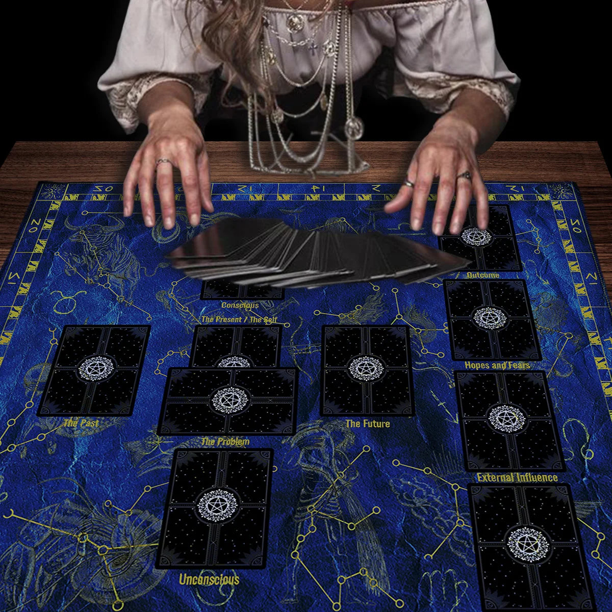 A dark blue altar cloth featuring a Celtic Cross design with various tarot symbols and astrological elements.