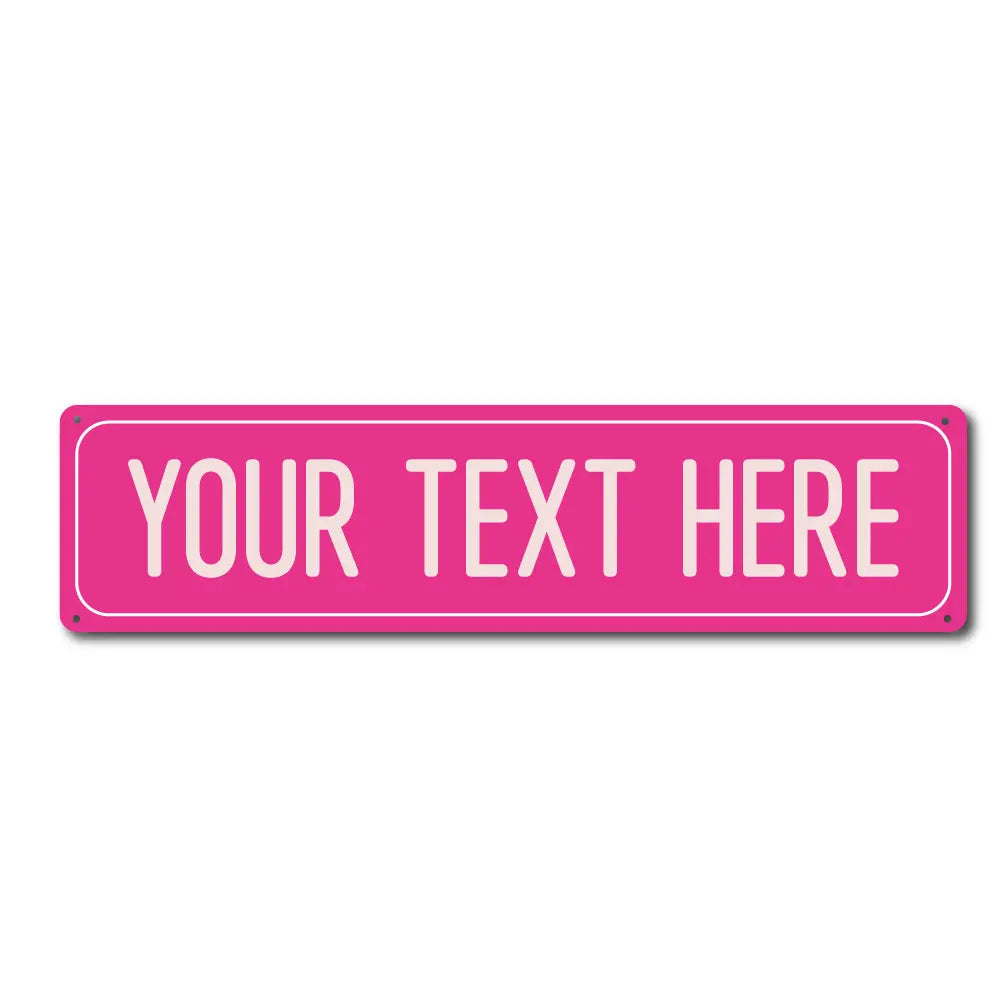 A pink rectangular metal street sign with the text YOUR TEXT HERE.