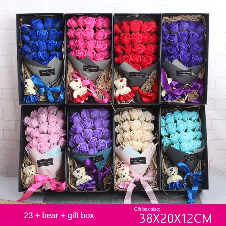 A gift box filled with bouquets of blue, pink, and red rose soap flowers.