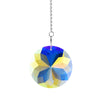 A hanging crystal wind chime featuring blue, yellow, and clear faceted glass elements.