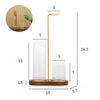 A tall, gold-colored glass incense holder with a removable ash catcher and a slender stand.