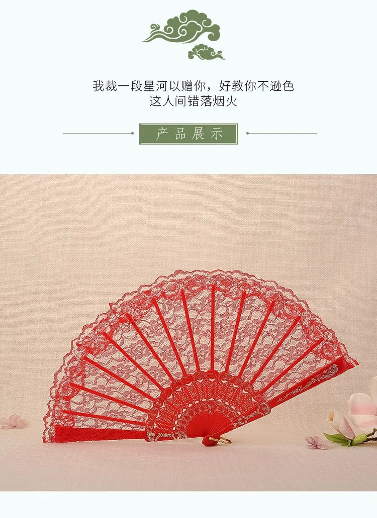 A red lace folding fan is displayed against a light background.
