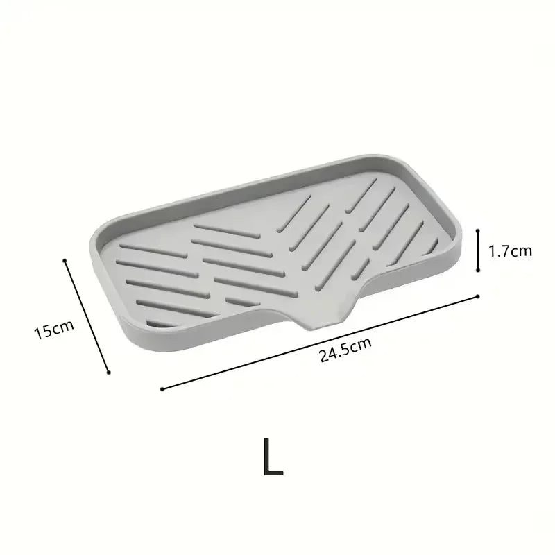 A rectangular silicone faucet splash guard and drying mat with parallel grooves.
