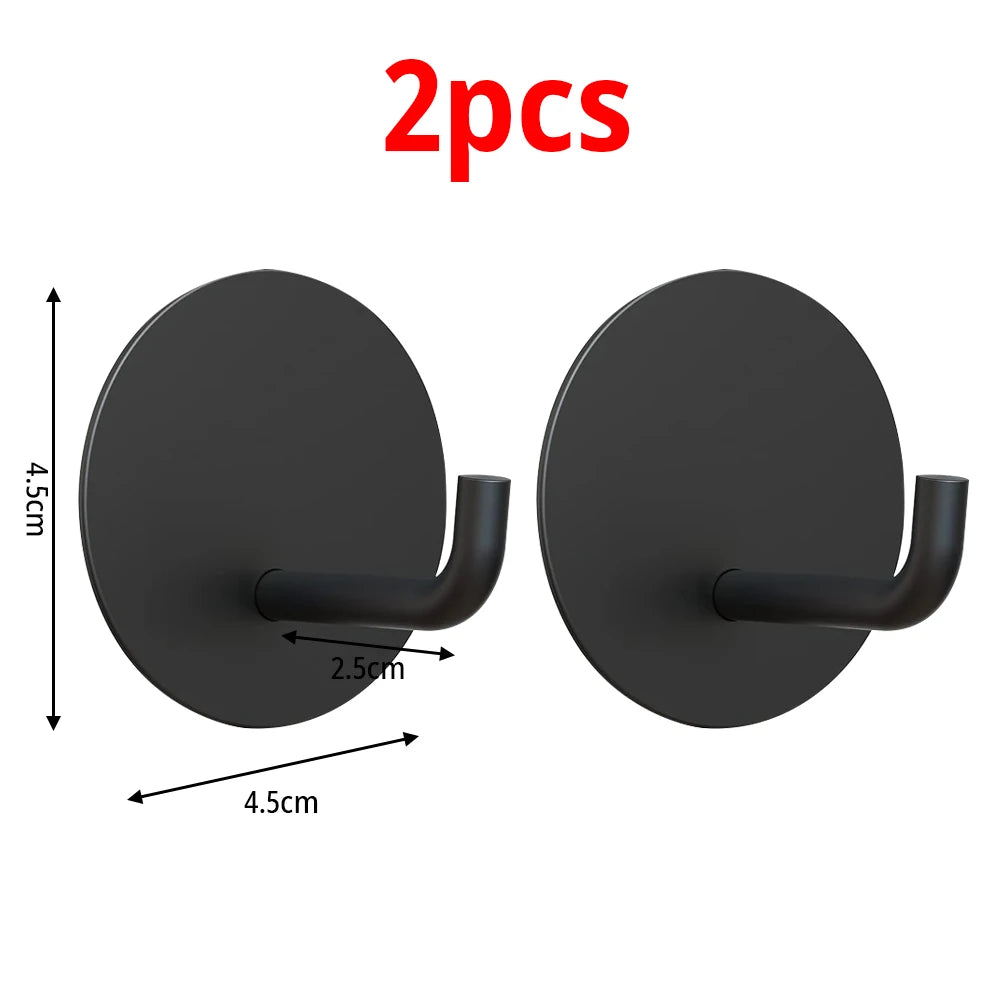 Two black stainless steel self-adhesive wall hooks shown with dimensions.