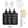 A set of UV resin curing products including hands, vials, and resin bottles for jewelry making.