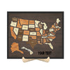 A custom engraved wooden USA travel map puzzle featuring the states and regions.