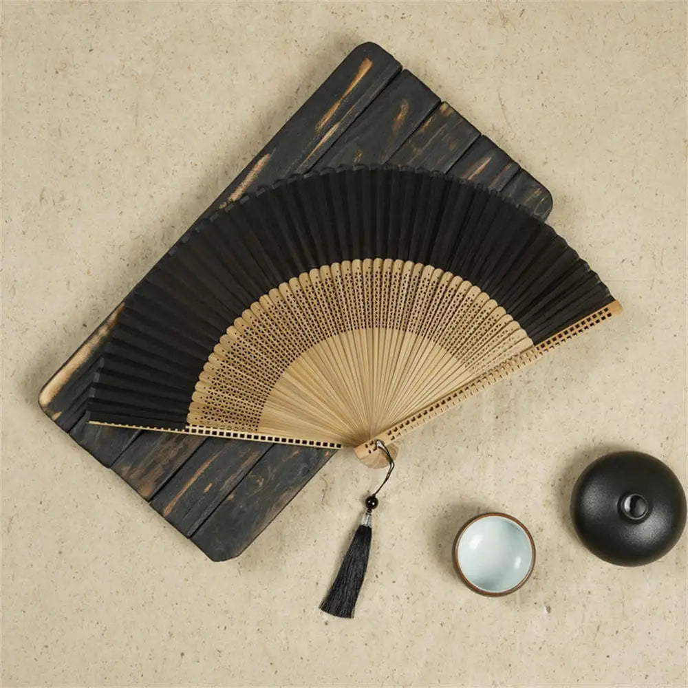Traditional Bamboo Folding Fan with Solid Color Design