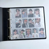 A black photo card binder displaying multiple photos of K-Pop idols.