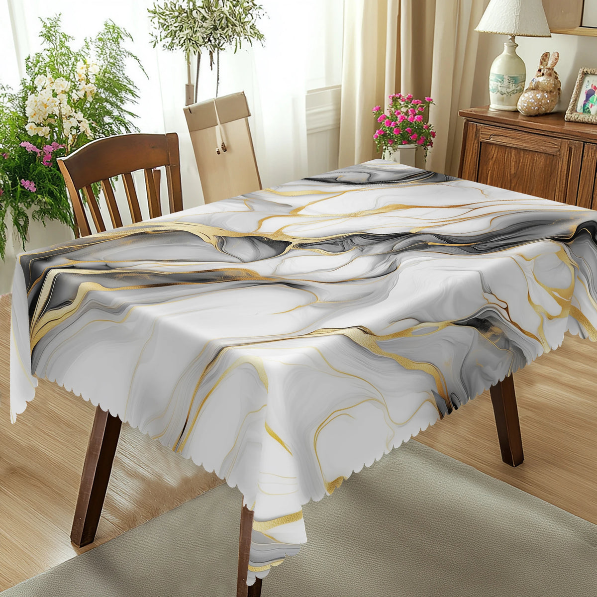 Marble-printed tablecloth featuring gray and gold ink textures on a round table.