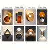 A collection of modern geometric canvas wall art featuring various shapes and metallic finishes.