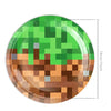 A green plate decorated with a pixelated theme featuring brown and orange colors.