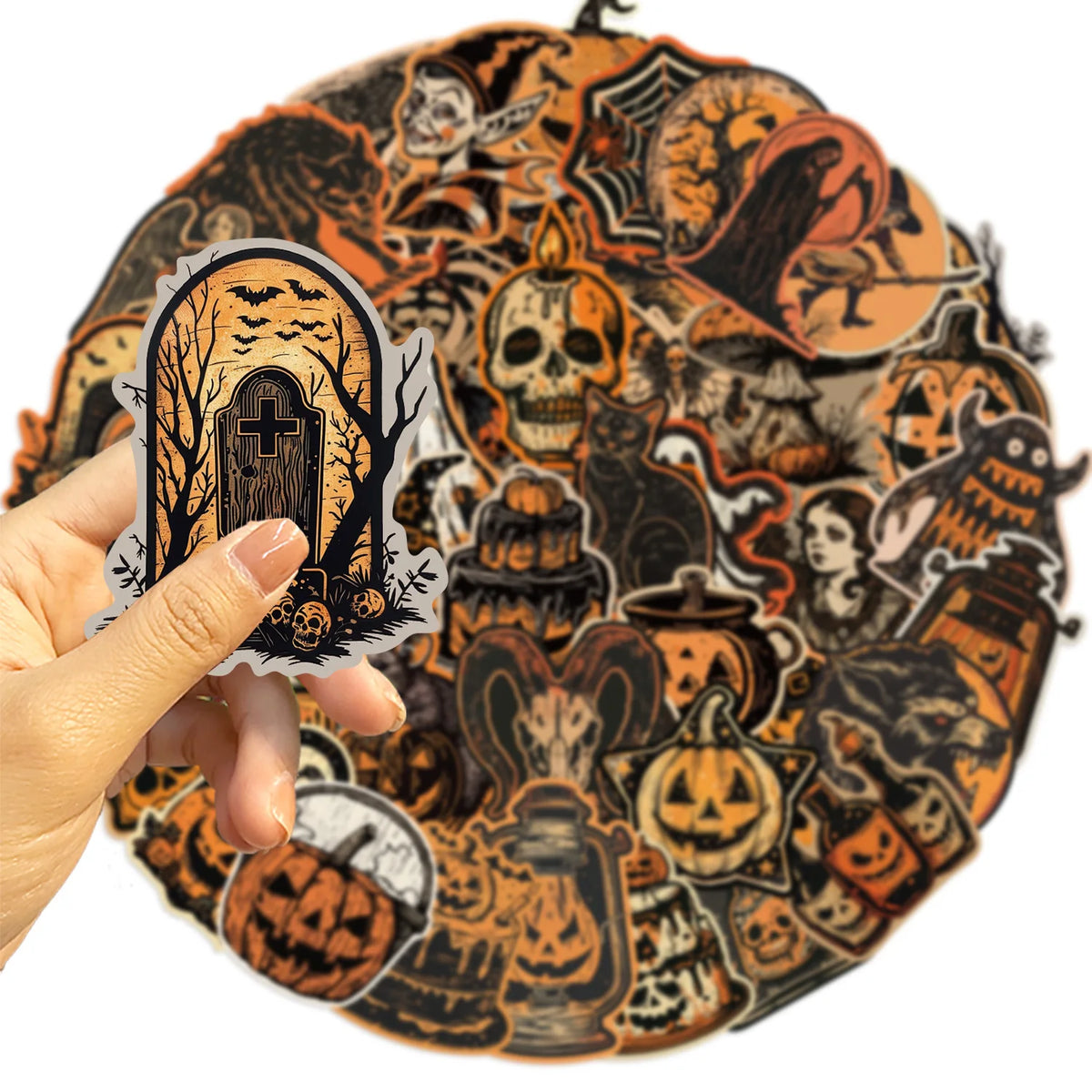 A hand holds a round sticker featuring a dark, retro graffiti aesthetic design with skulls and Halloween elements.