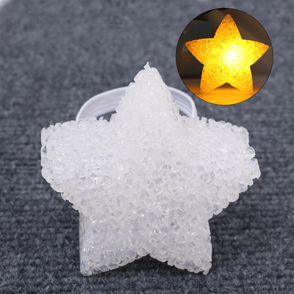 A clear, star-shaped object made of sparkling white plastic is shown next to a close-up of a golden star light.