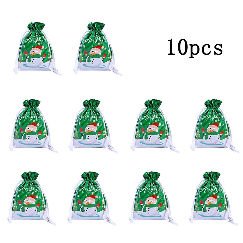 Ten reusable green and white Christmas drawstring gift bags featuring a snowflake design