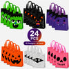 A collection of 24 reusable Halloween candy bags in various colors and designs including green, black, purple, orange, and pi