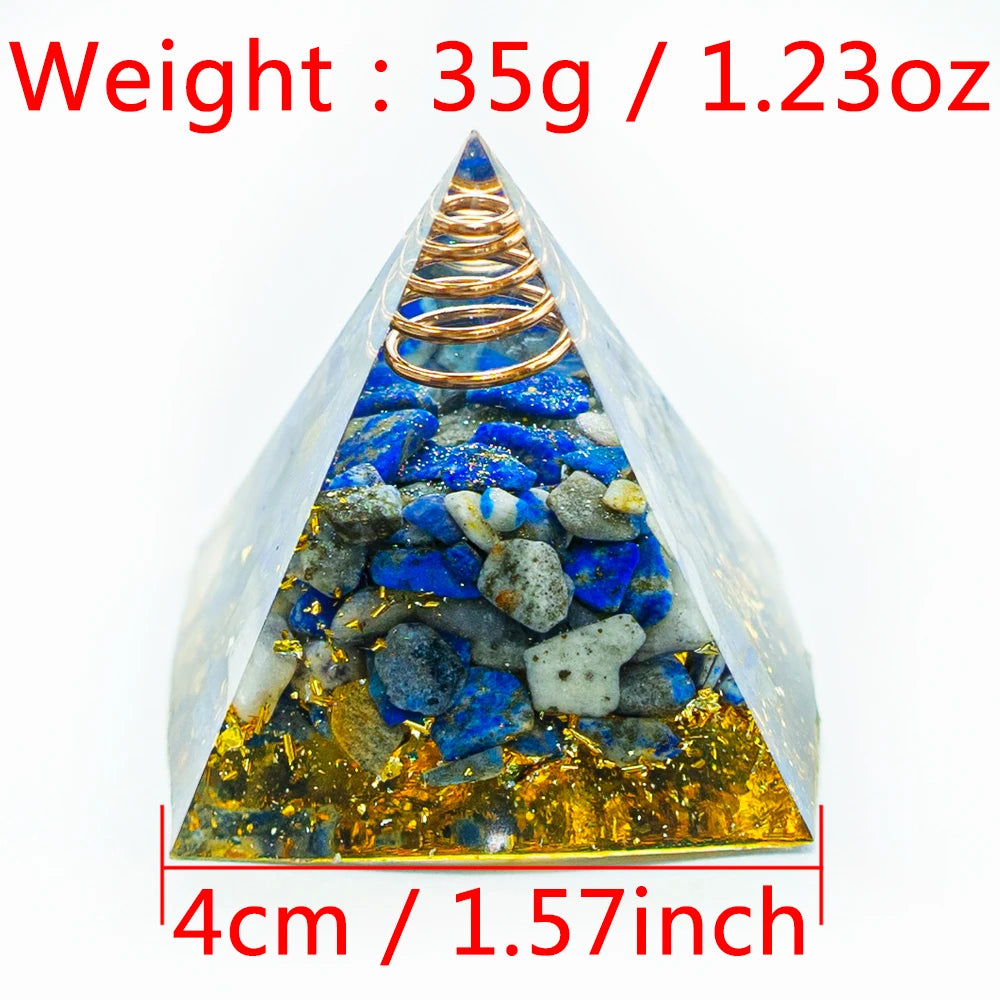 A pyramid-shaped crystal display featuring blue and yellow stones with a copper coil inside.